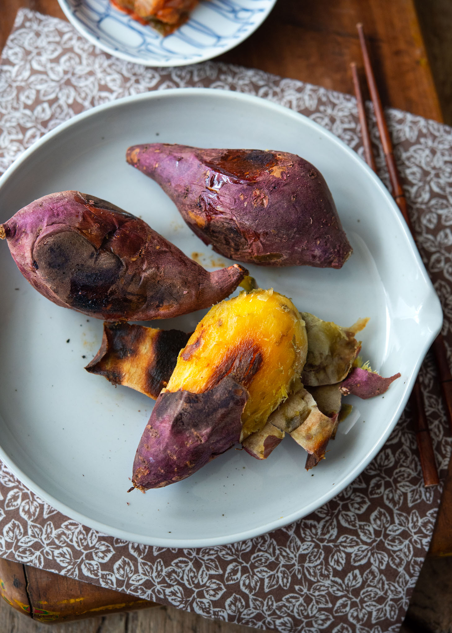 Pan roasted Korean sweet potato is peeled and shows the caramelization in the flesh.