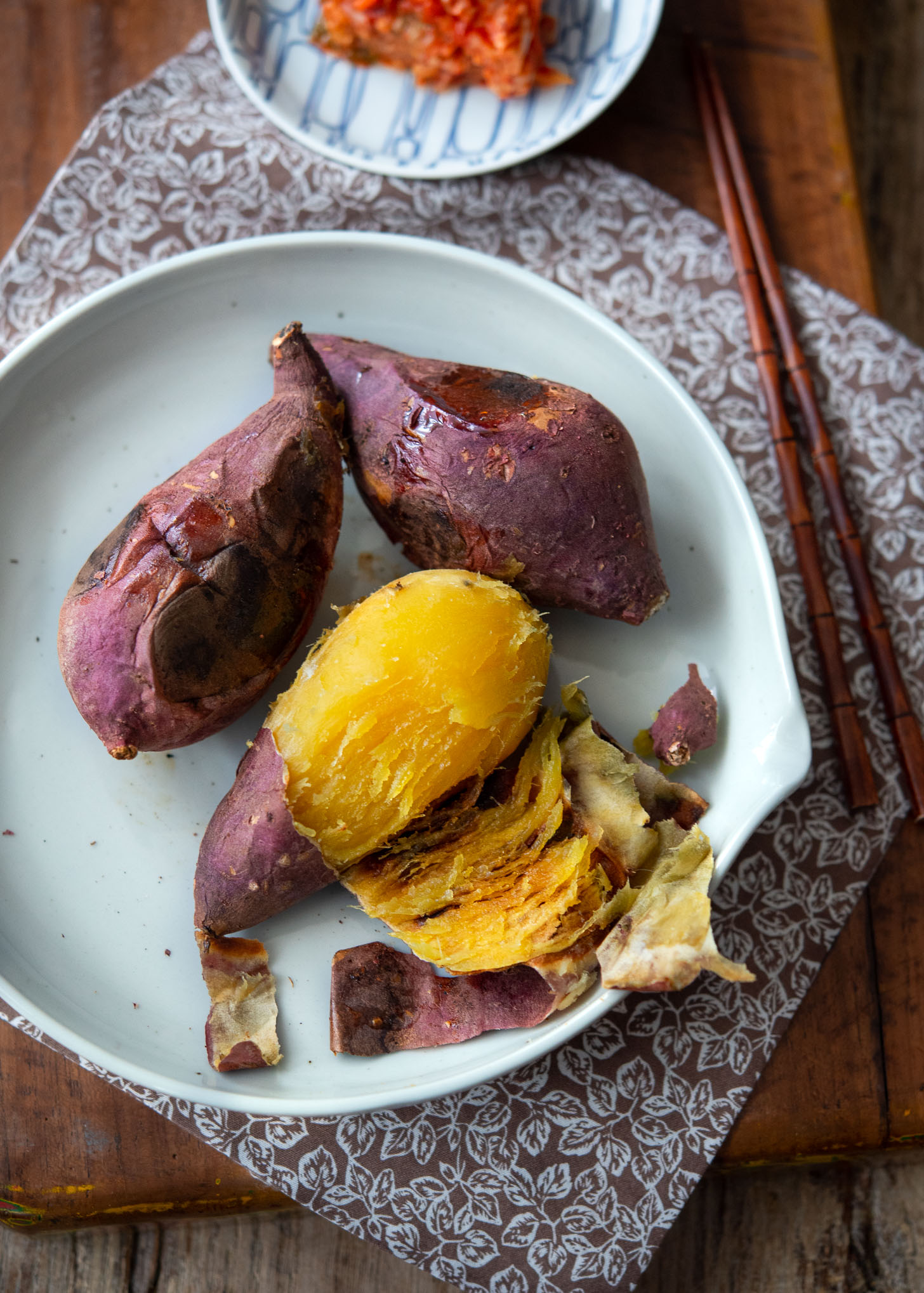 Pan roasted Korean sweet potato is peeled and shows its golden orange flesh inside.