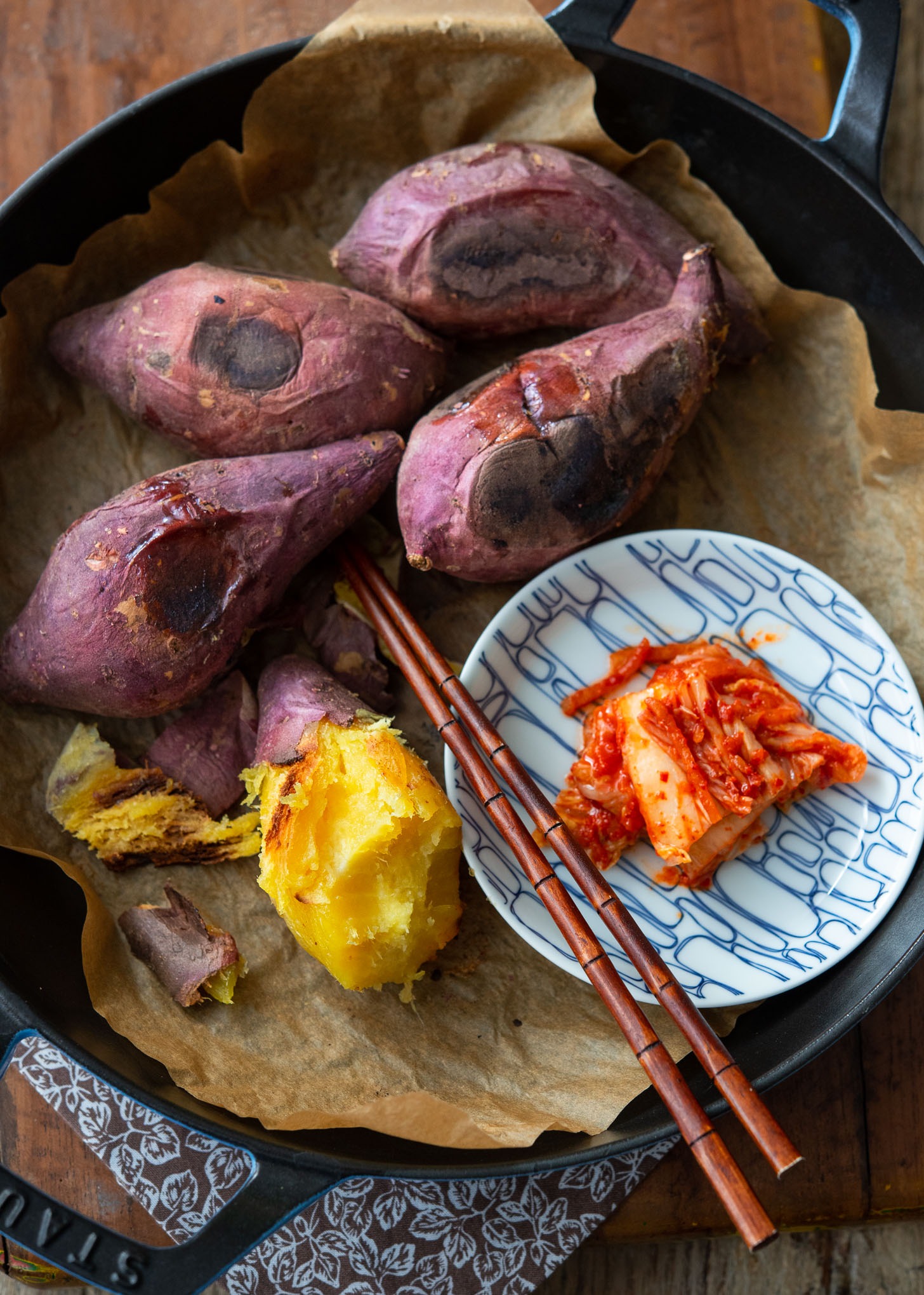 Roasted Korean sweet potato is served with kimchi.