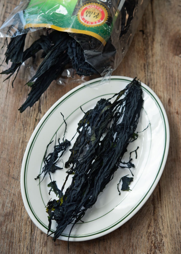 Dried seaweed laver is on a plate to show its texture.