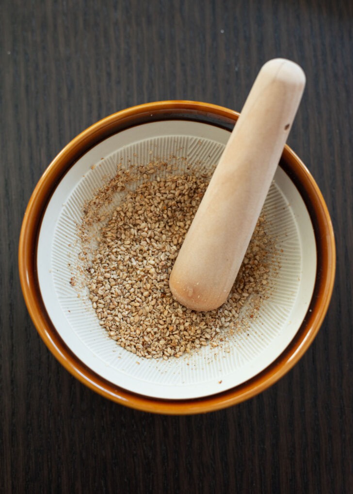 Toasted sesame seeds in a Japanese mortar and pestle.