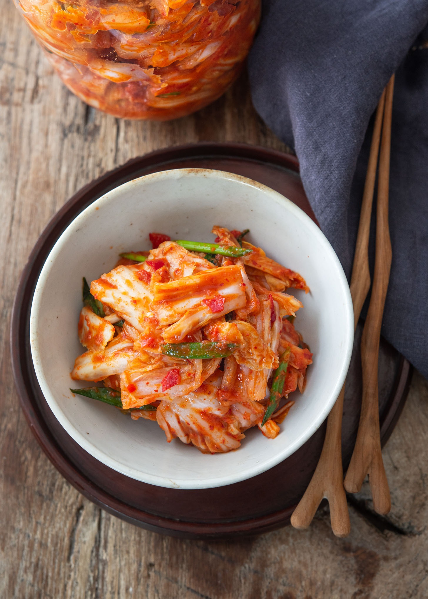 A top view of vegan kimchi served with chopsticks.
