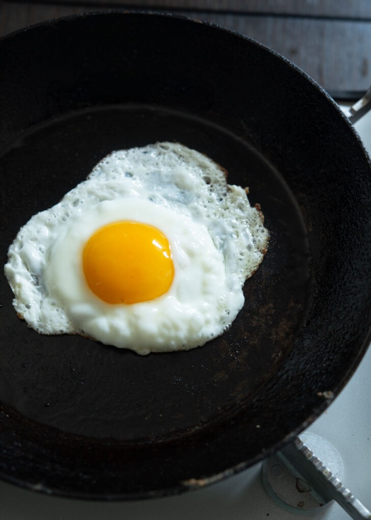 A fried egg to sunny-side-up to make Korean egg rice (gyeran bap).