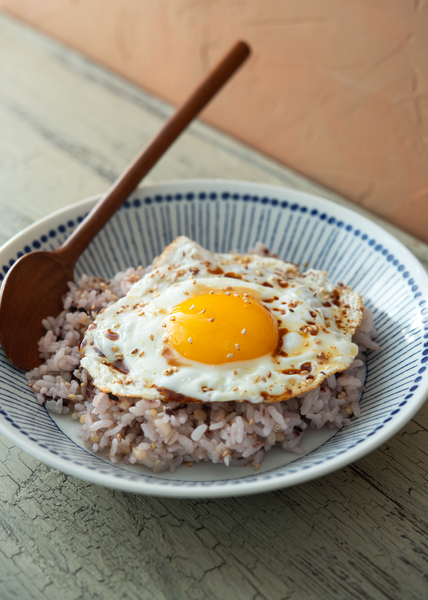 Fried egg with rice to make gyeran bop, Korean breakfast.