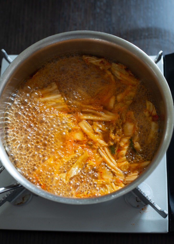 Sliced kimchi added to instant ramen broth.
