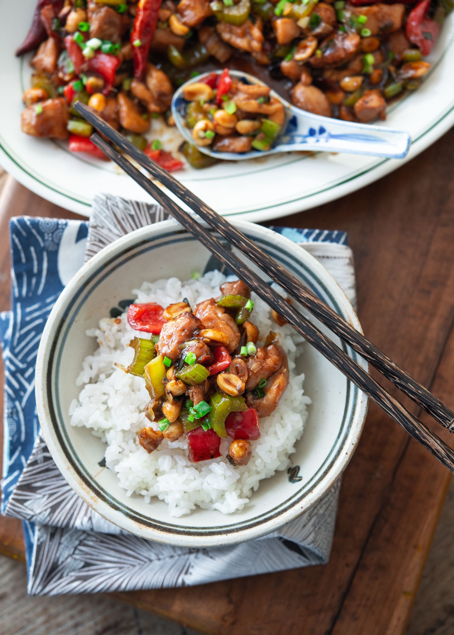 A top view of authentic Kung Pao chicken served over rice.