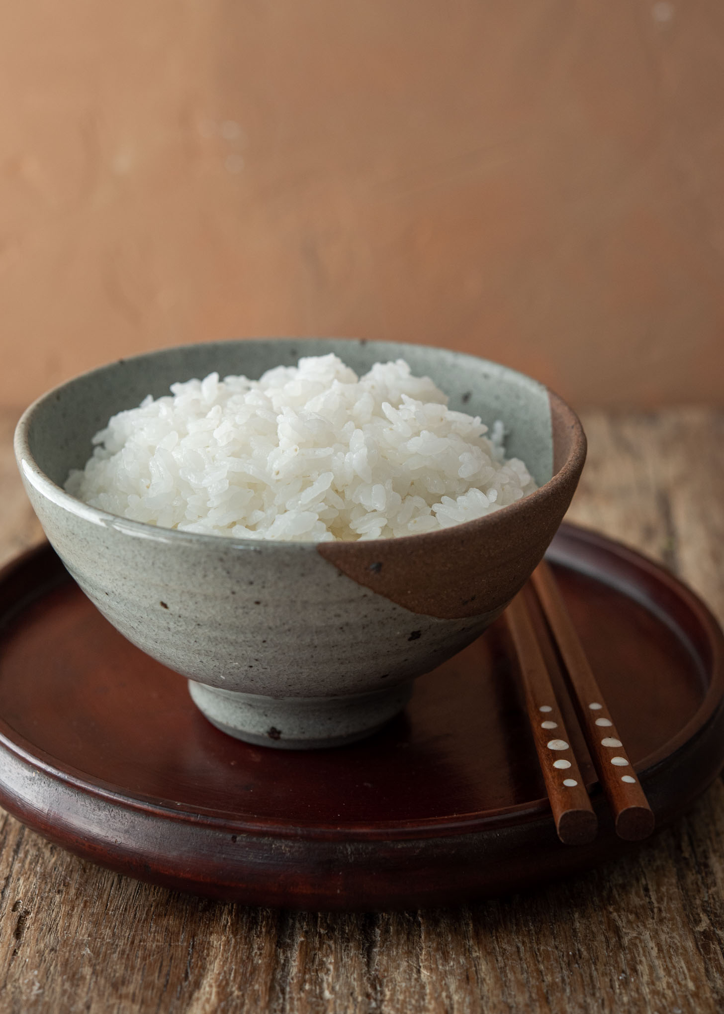 A bowl of perfectly cooked Korean rice (short grain rice) on the stove.