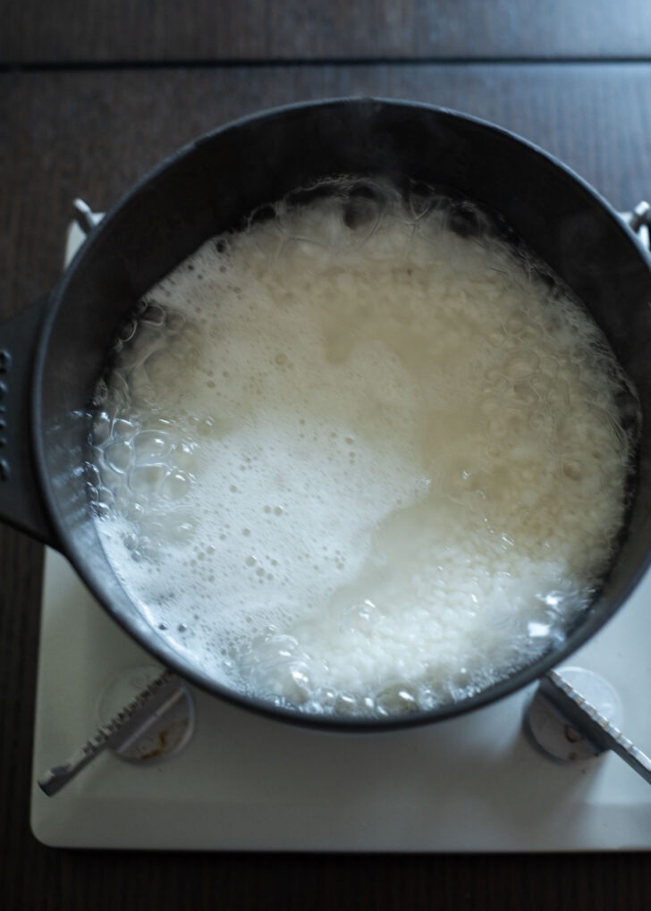 White short grain rice in the boiling water.