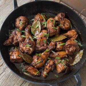 Filipino chicken adobo in a skillet.