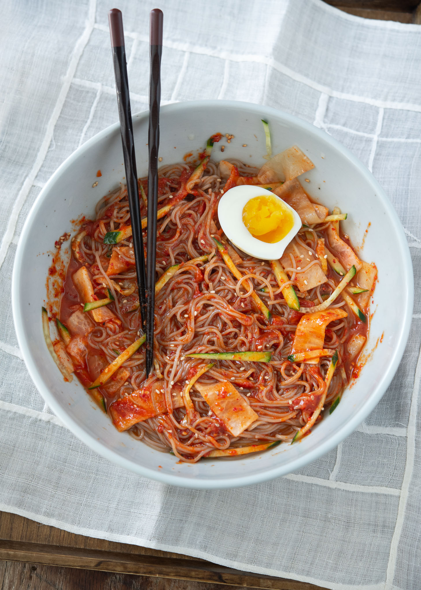 Spicy bibim naengmyeon (cold noodles) mixed with the sauce.