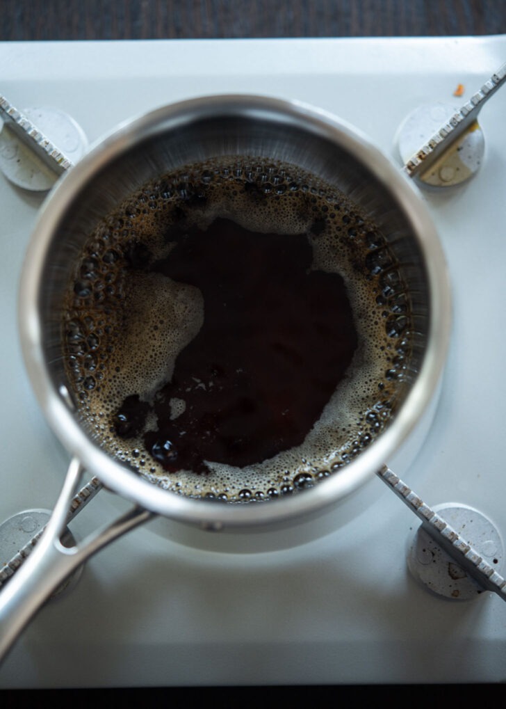 soy sauce mixture for making naengmyeon sauce boiling in a pot