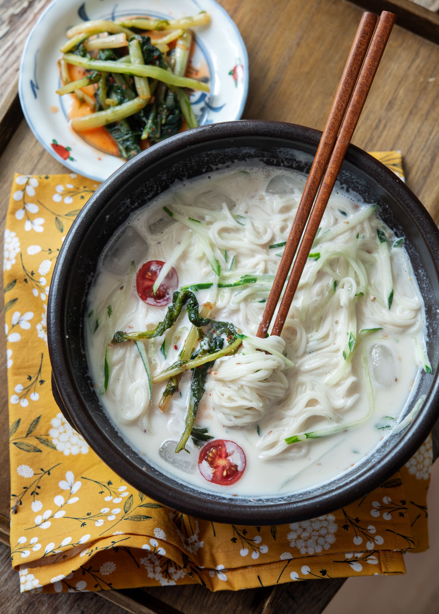 Kongguksu in cold soy milk soup base served cold with summertime Korean kimchi.