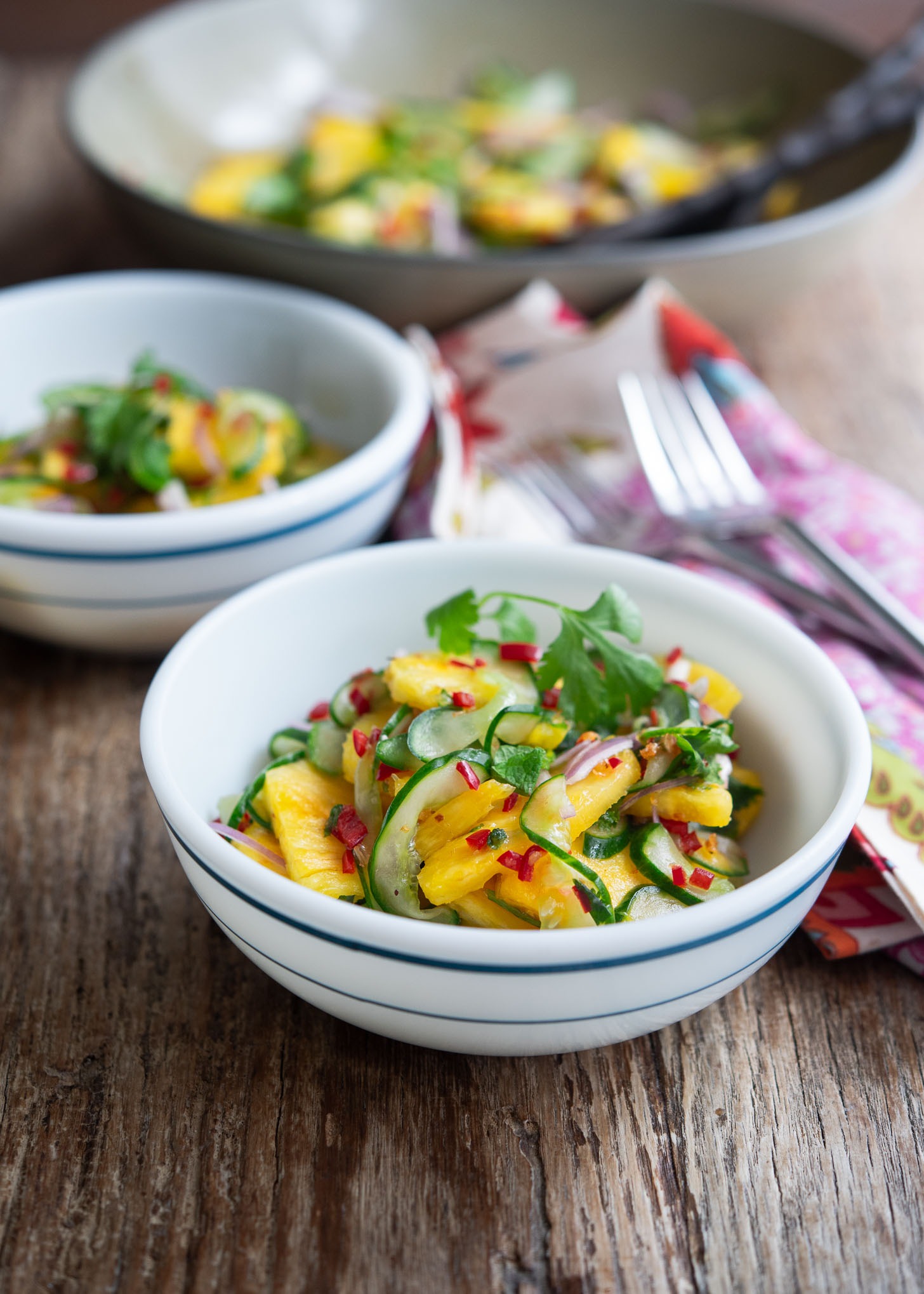 Vibrant colors of Pineapple cucumber salad with Asian flavor.