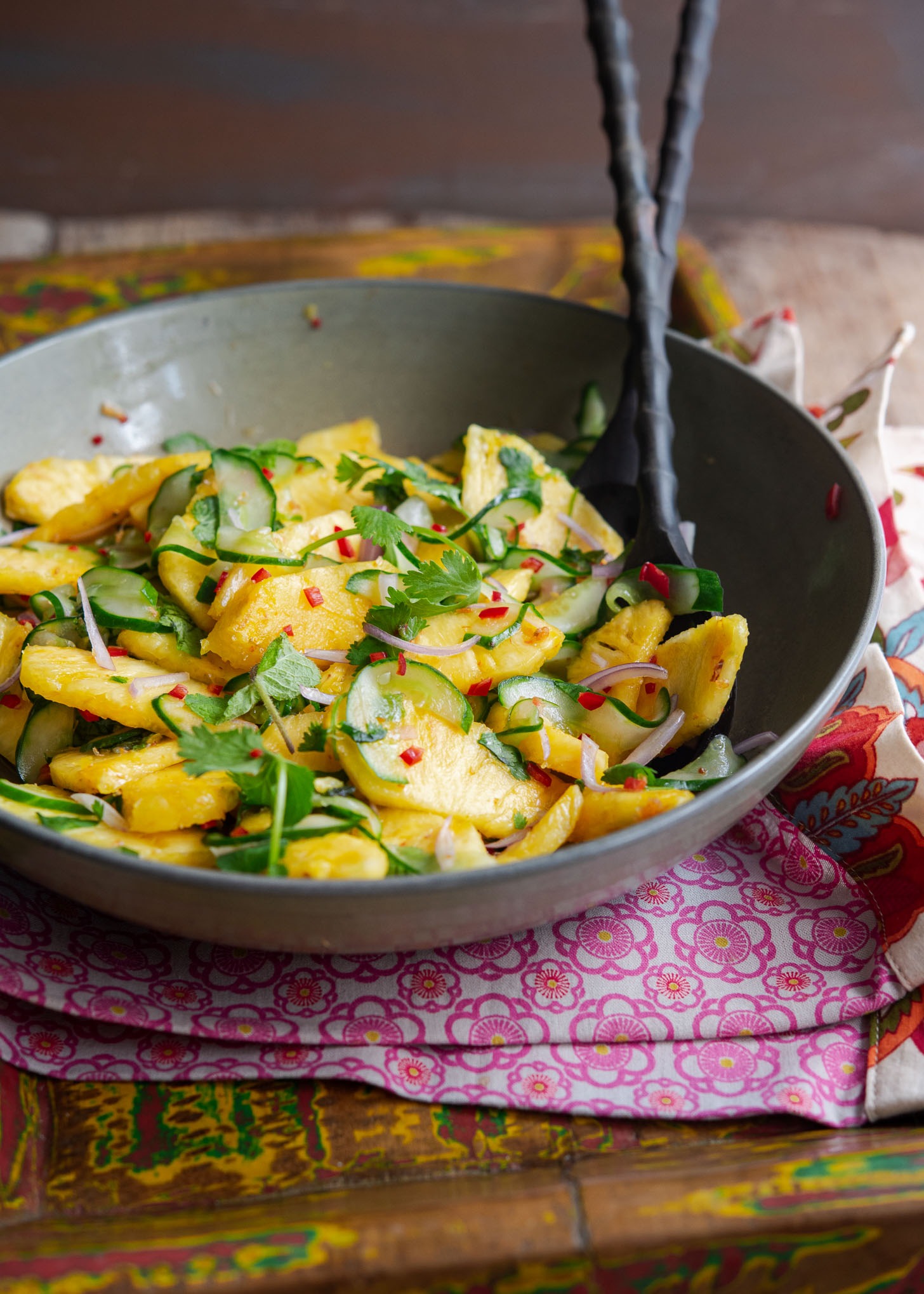 Asian flavored pineapple cucumber salad in a bowl.