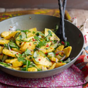 Asian flavored pineapple cucumber salad in a bowl.