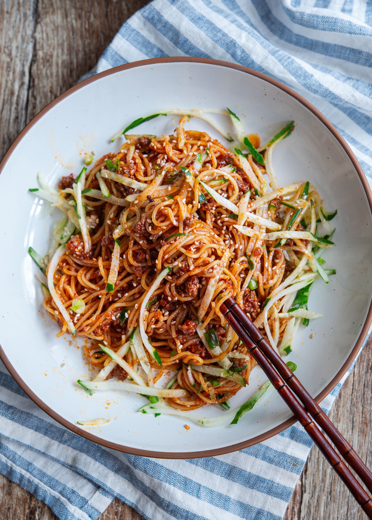 Gochujang noodles made with ground beef served in a bowl.