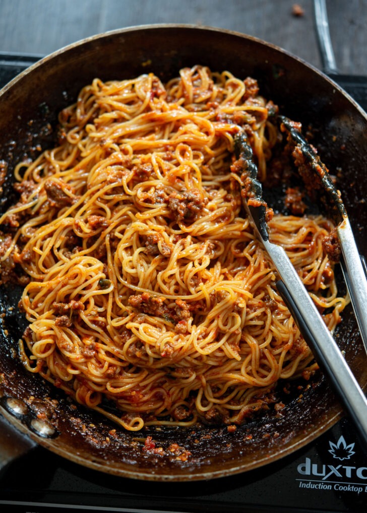 Noodles are tossed with beef gochujang sauce 