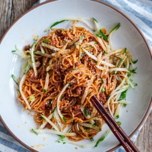 Gochujang noodles made with ground beef served in a bowl.