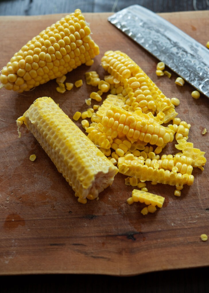 Corn kernels are separated from the cob.