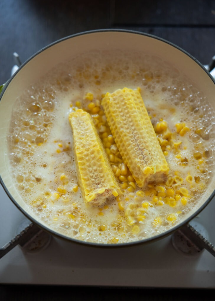 Water boiling from making corn and rice in a pot