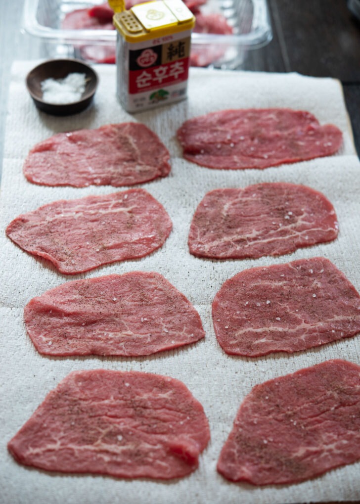 Thin beef slices seasoned with salt and pepper