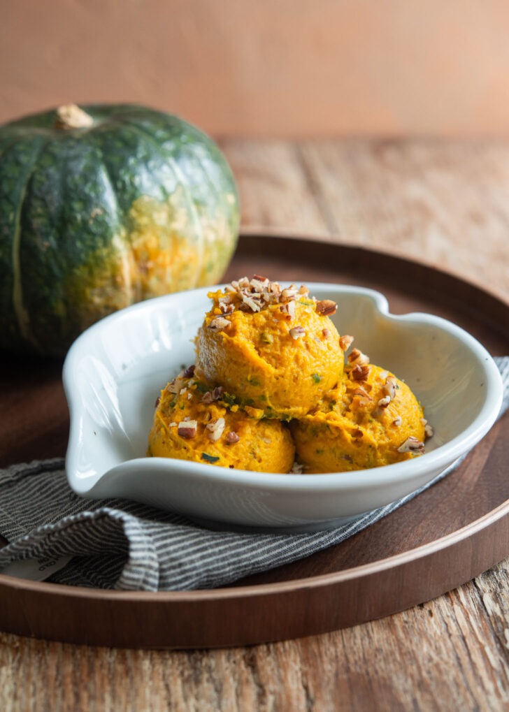Kabocha squash salad is presented in a serving bowl.