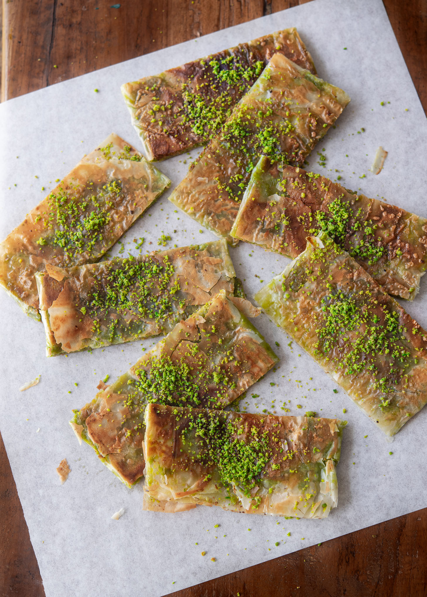 Turkish pistachio dessert slices garnished with ground pistachio nut.