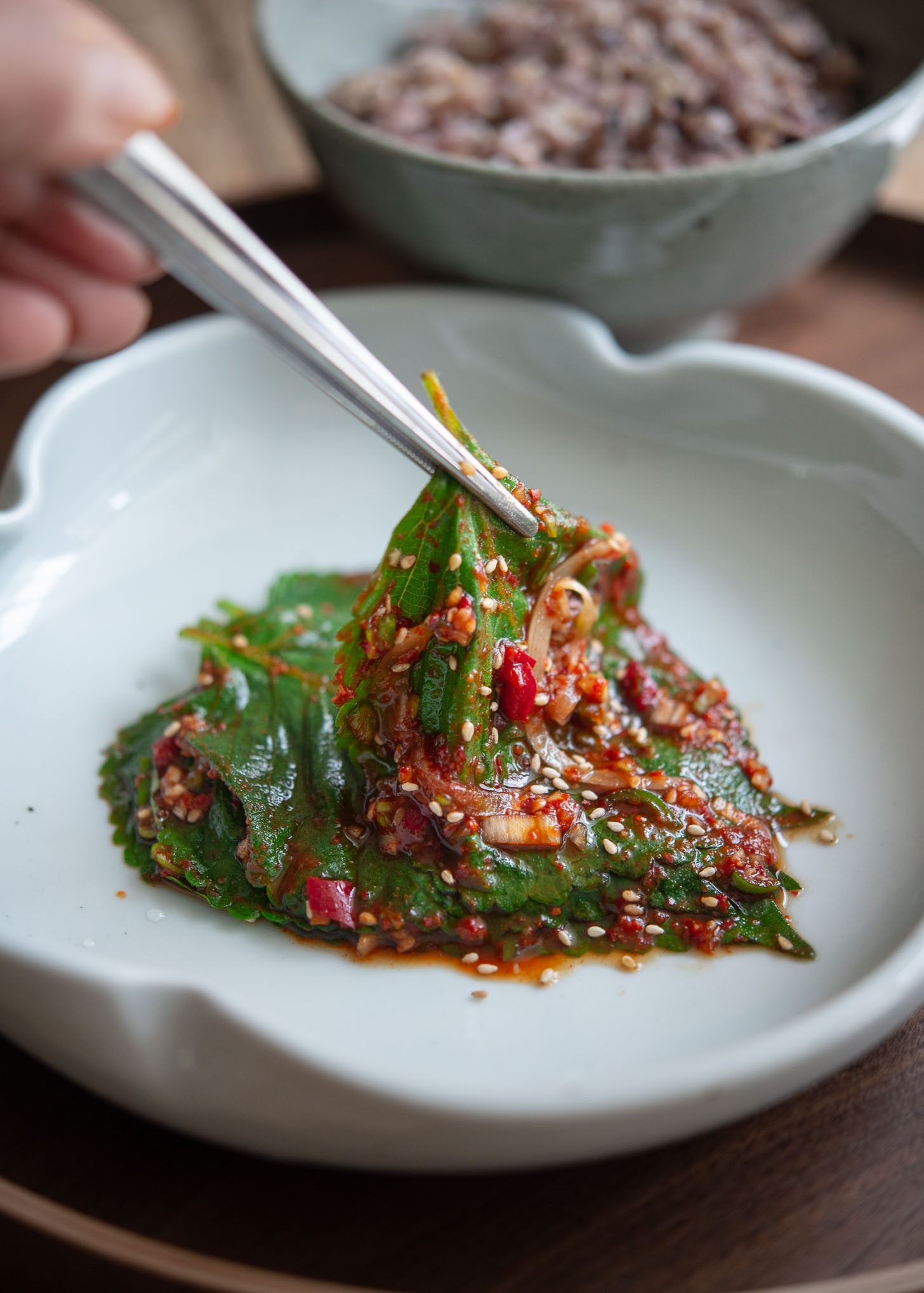 Perilla leaf kimchi known as Kaennip kimchi using chopstick to serve