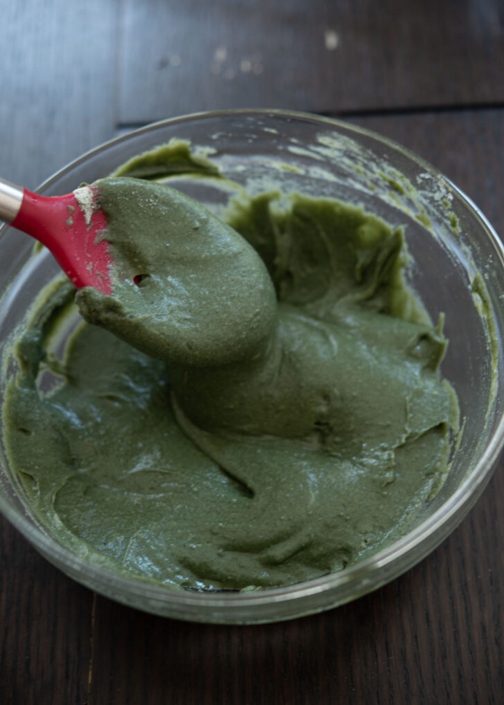 Mugwort injeolmi dough is mixed in a bowl.