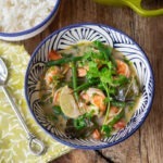 Top view of Thai green shrimp curry bowl with rice.