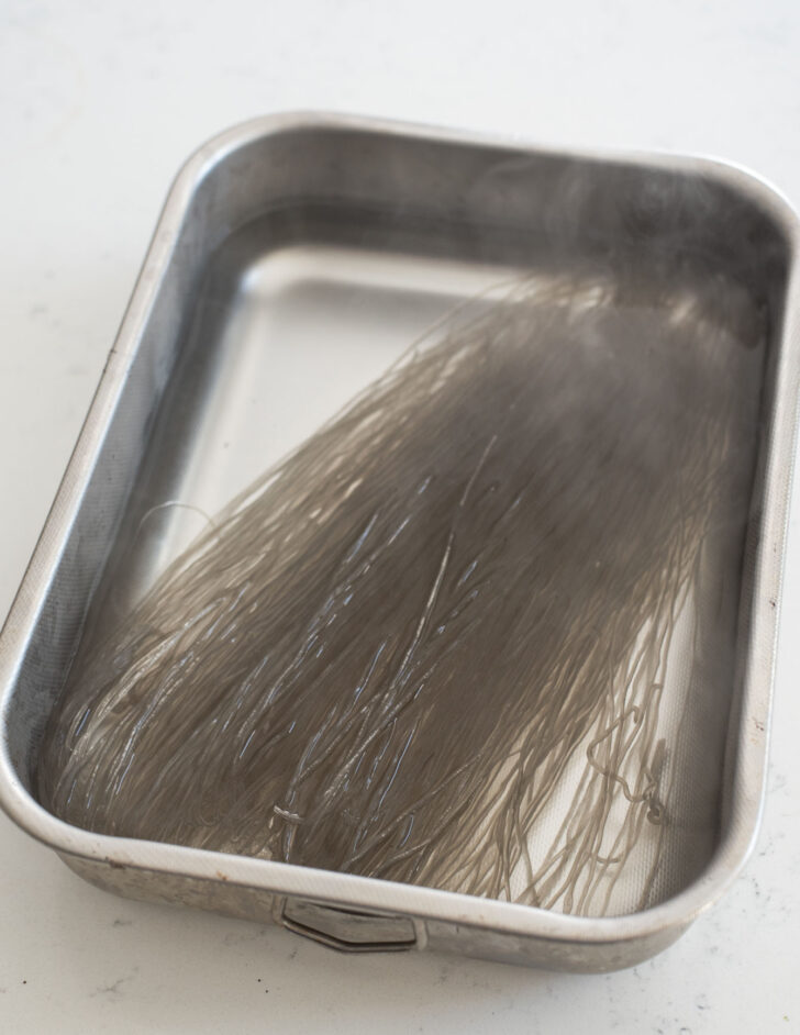 Sweet potato starch noodles soaking in hot water.