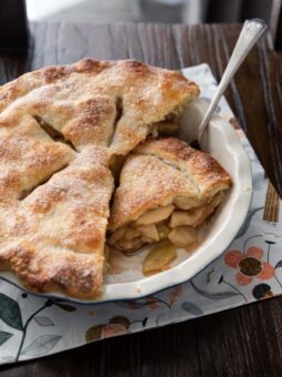 apple pie made in deep dish pie pan.