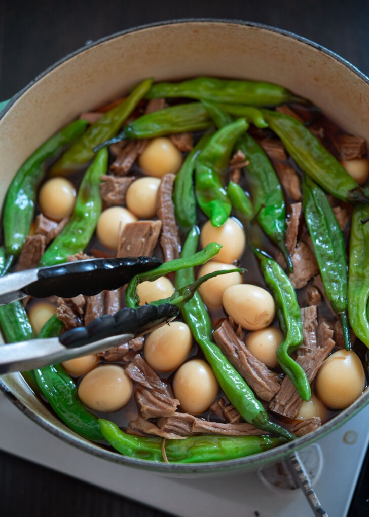 Braised soy sauce beef and eggs with shishito peppers.