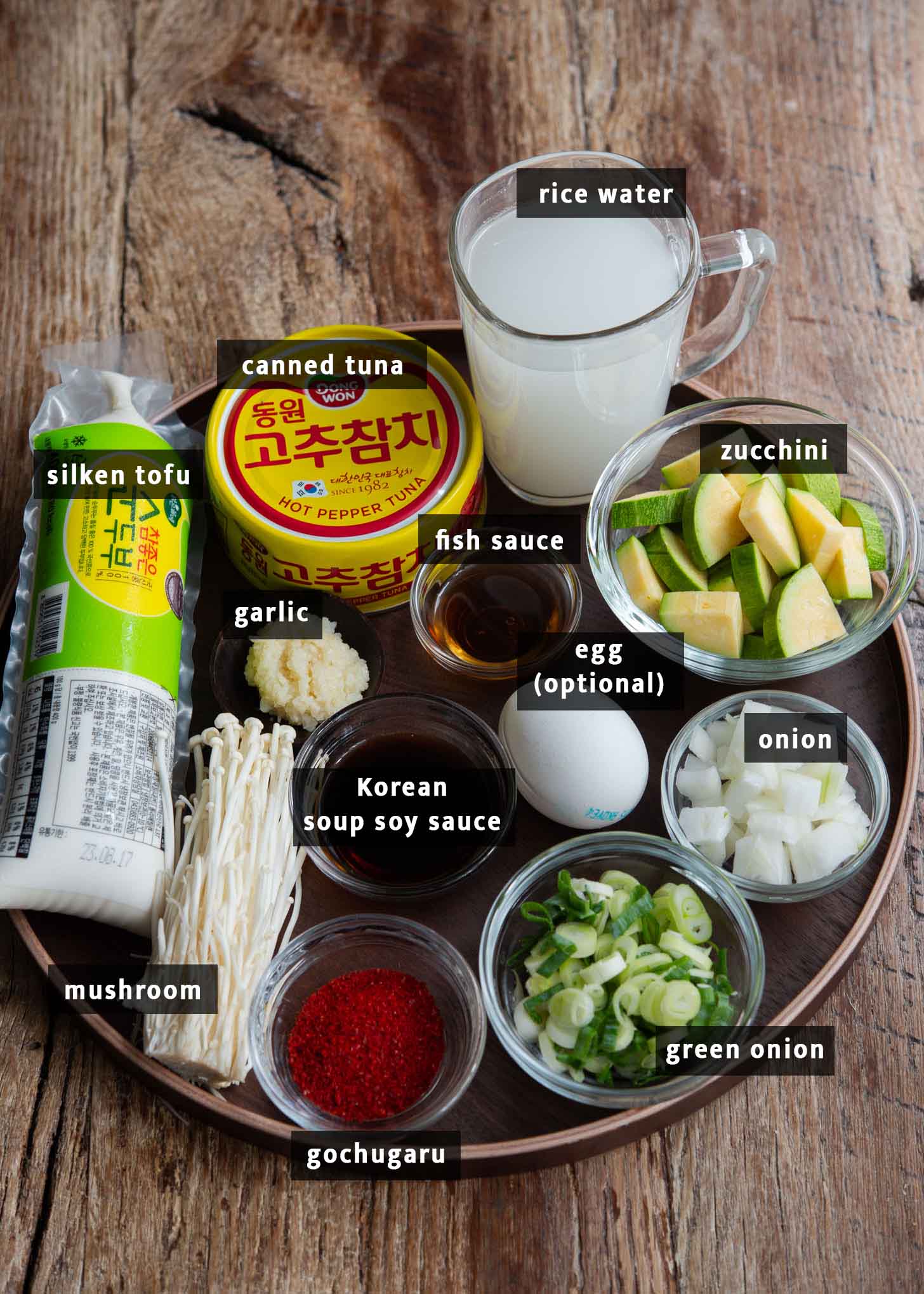 Ingredients presented for making Korean soft tofu soup (sundubu jjigae).