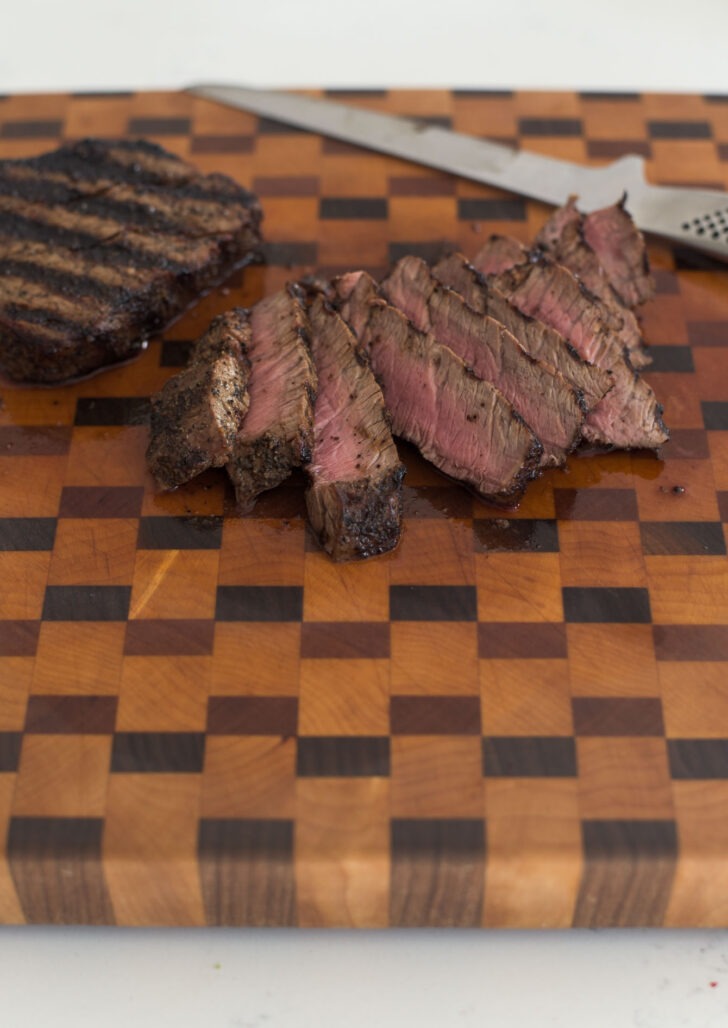 Grilled beef steak sliced into thin strips.