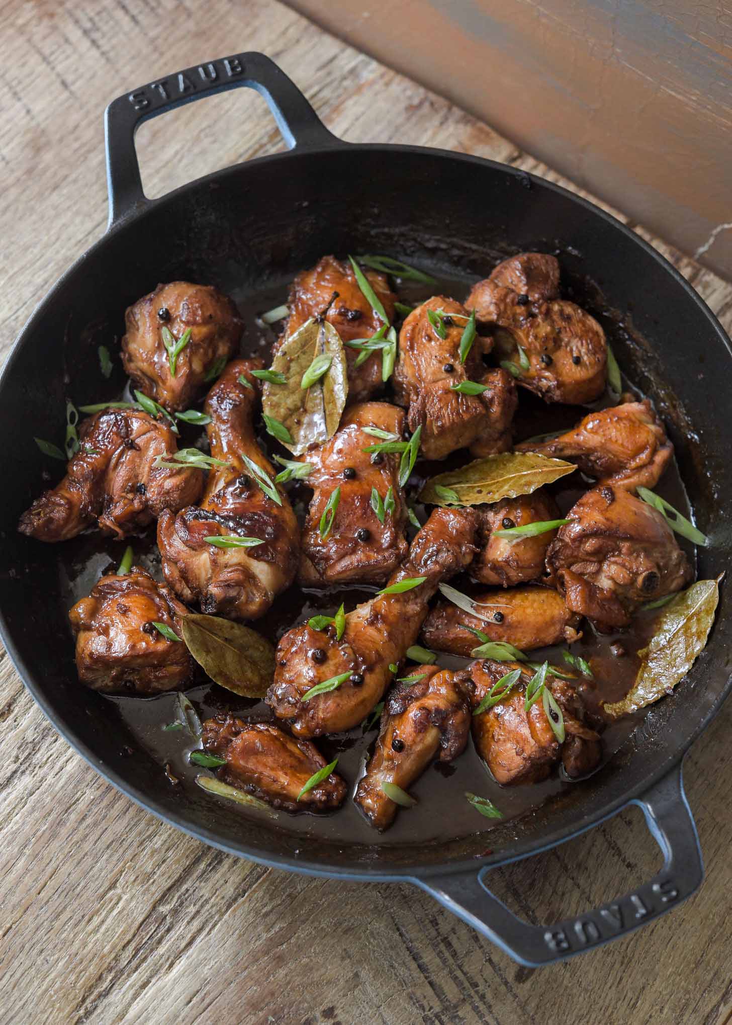 Chicken adobo Filipino style in a skillet.