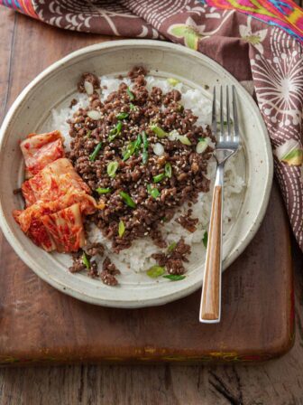 Korean beef bowl made with ground beef bulgogi and kimchi in a serving bowl.