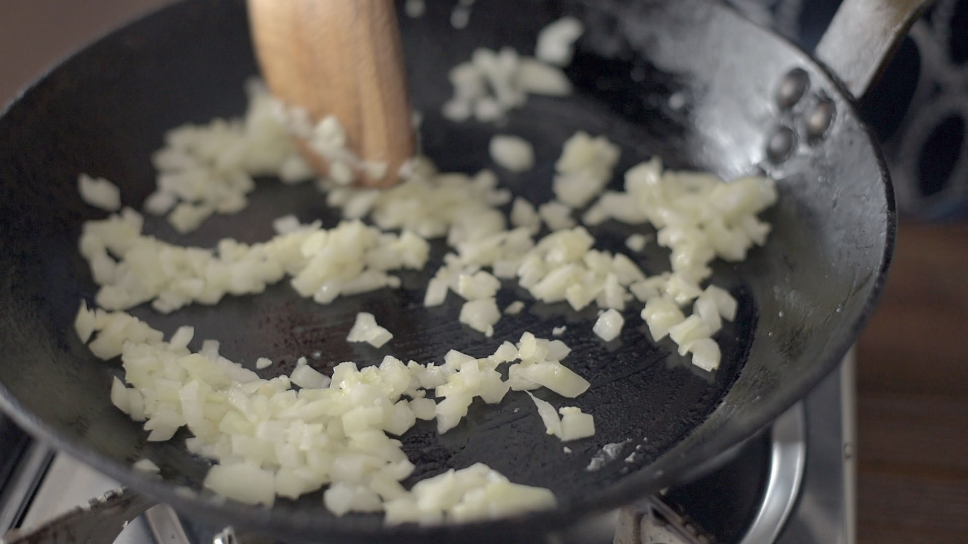 Onion and garlic cooking in a skillet.