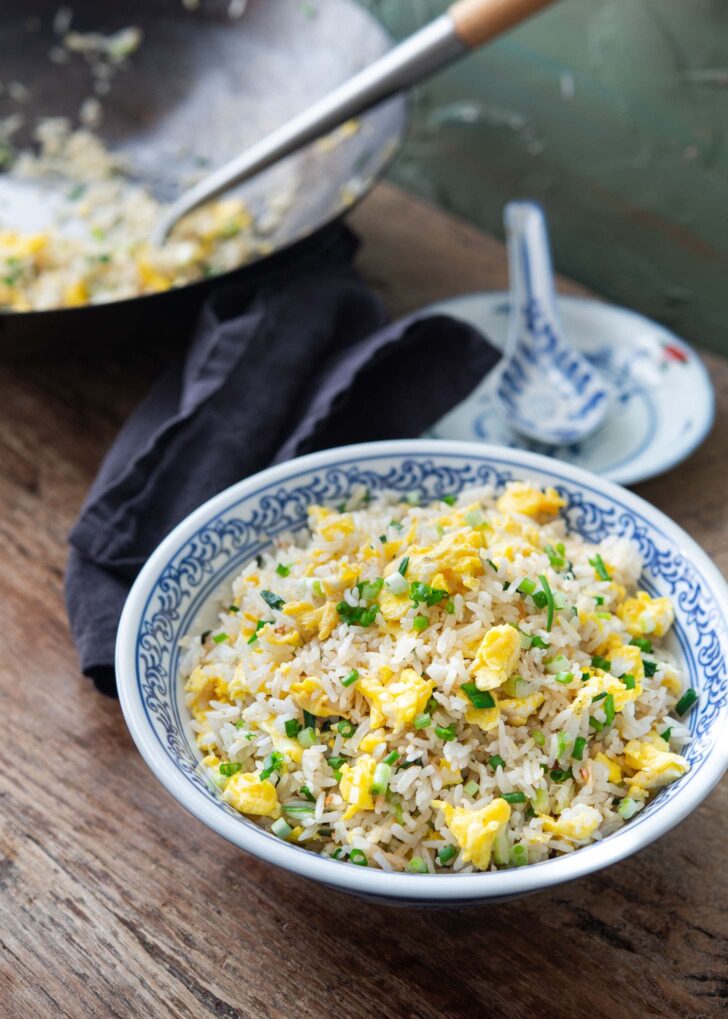 Easy egg fried rice in a bowl garnished with green onion.