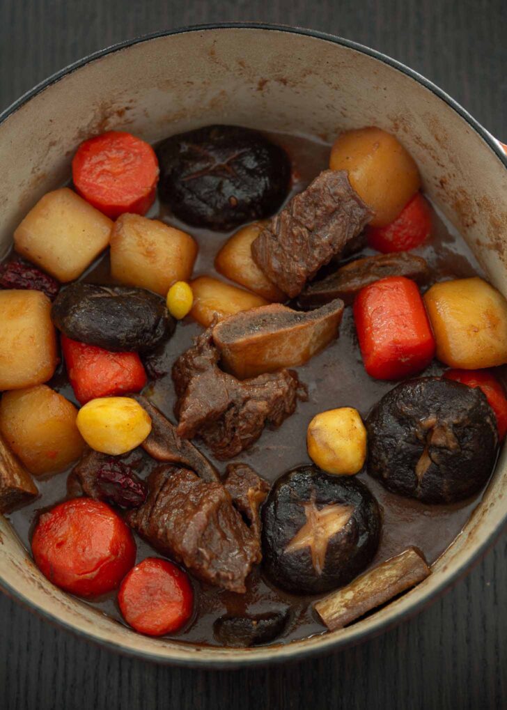 Korean short ribs and vegetables braised in a pot.