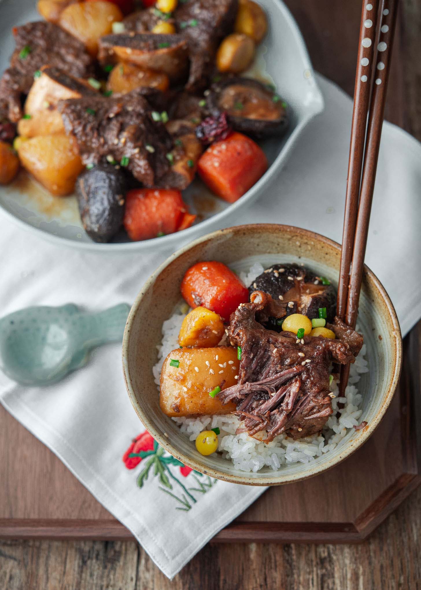Braised Korean short ribs with vegetables served with rice.