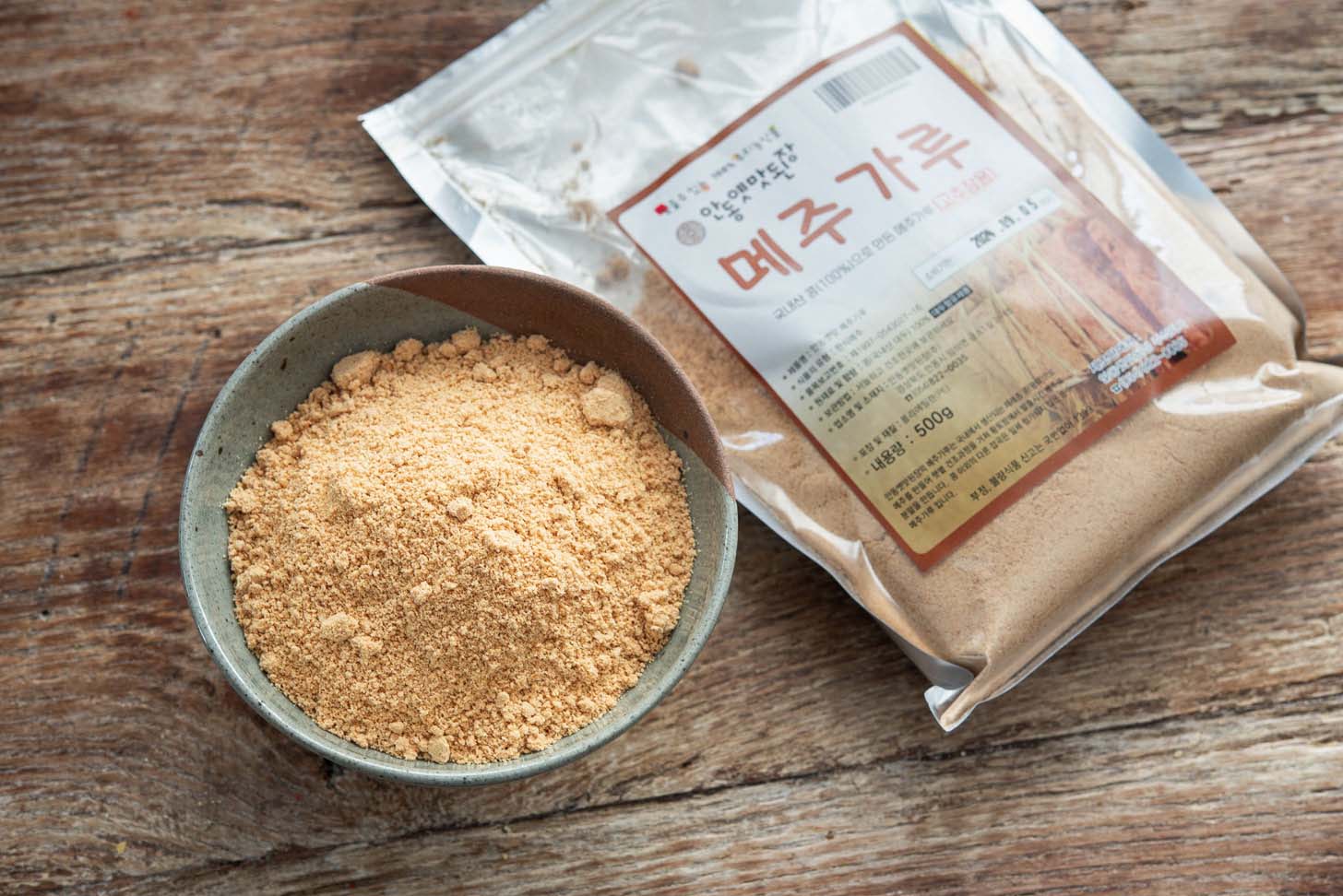 Fermented soybean powder (mejugaru) in a bowl.