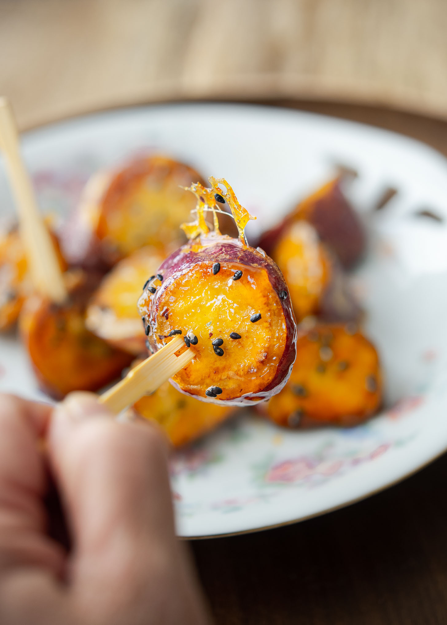 Crunchy candy-like shell on Korean sweet potato called goguma mattang.