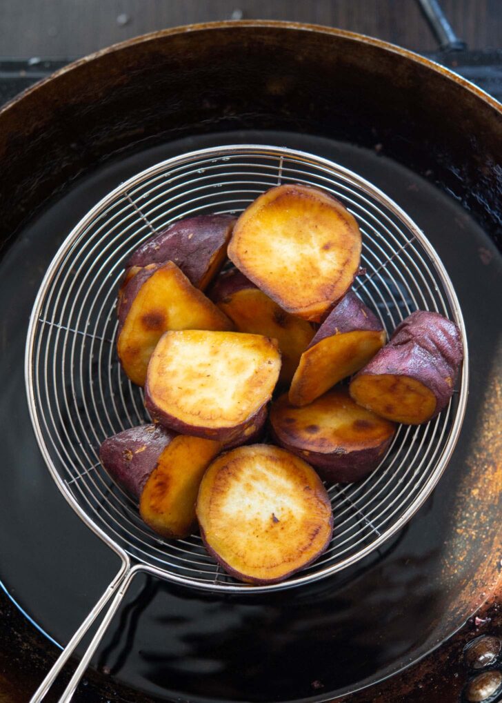 Golden brown and crispy Korean sweet potato out of frying oil.