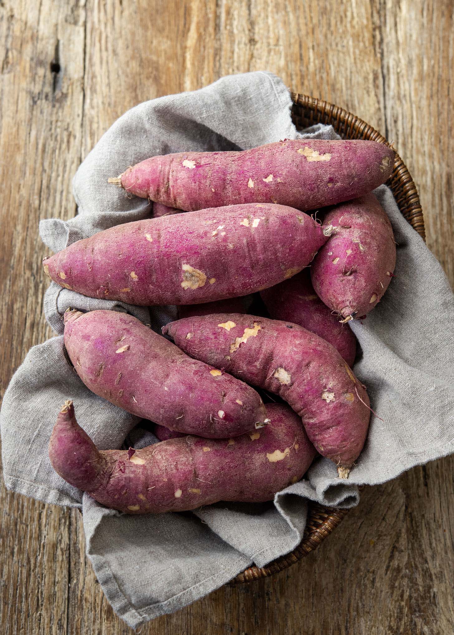 Korean sweet potatoes showing purple skin.