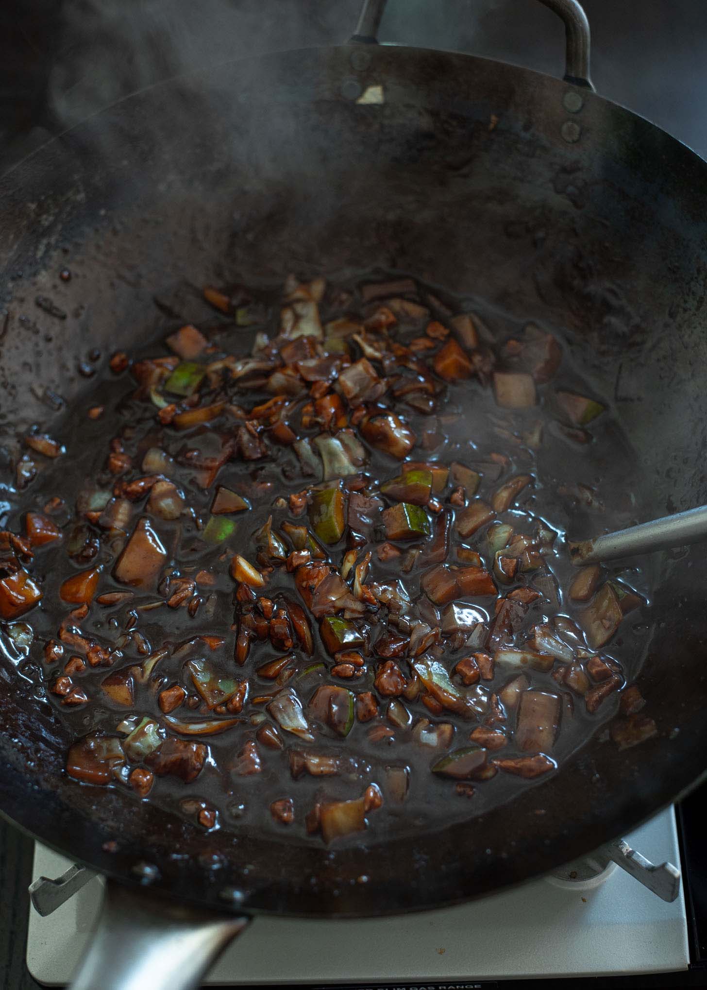 Jajangmyeon sauce is simmered in a wok.