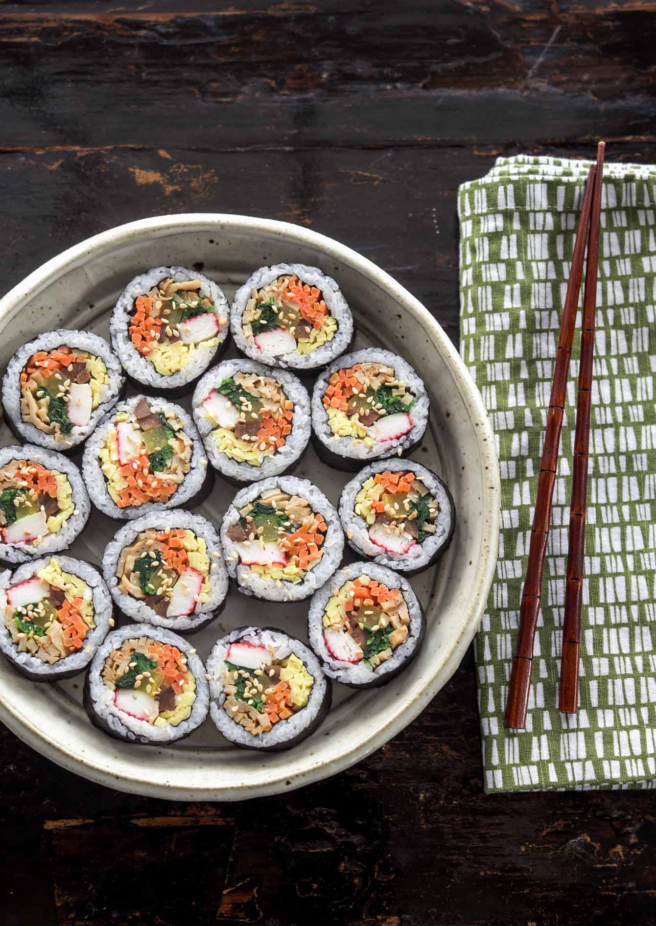Kimbap slices beautiful arranged in a serving dish.