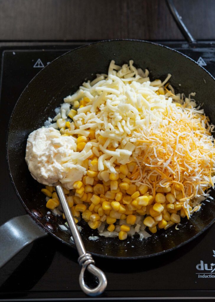 Corn kernels, cheeses, mayo added to the aromatics.