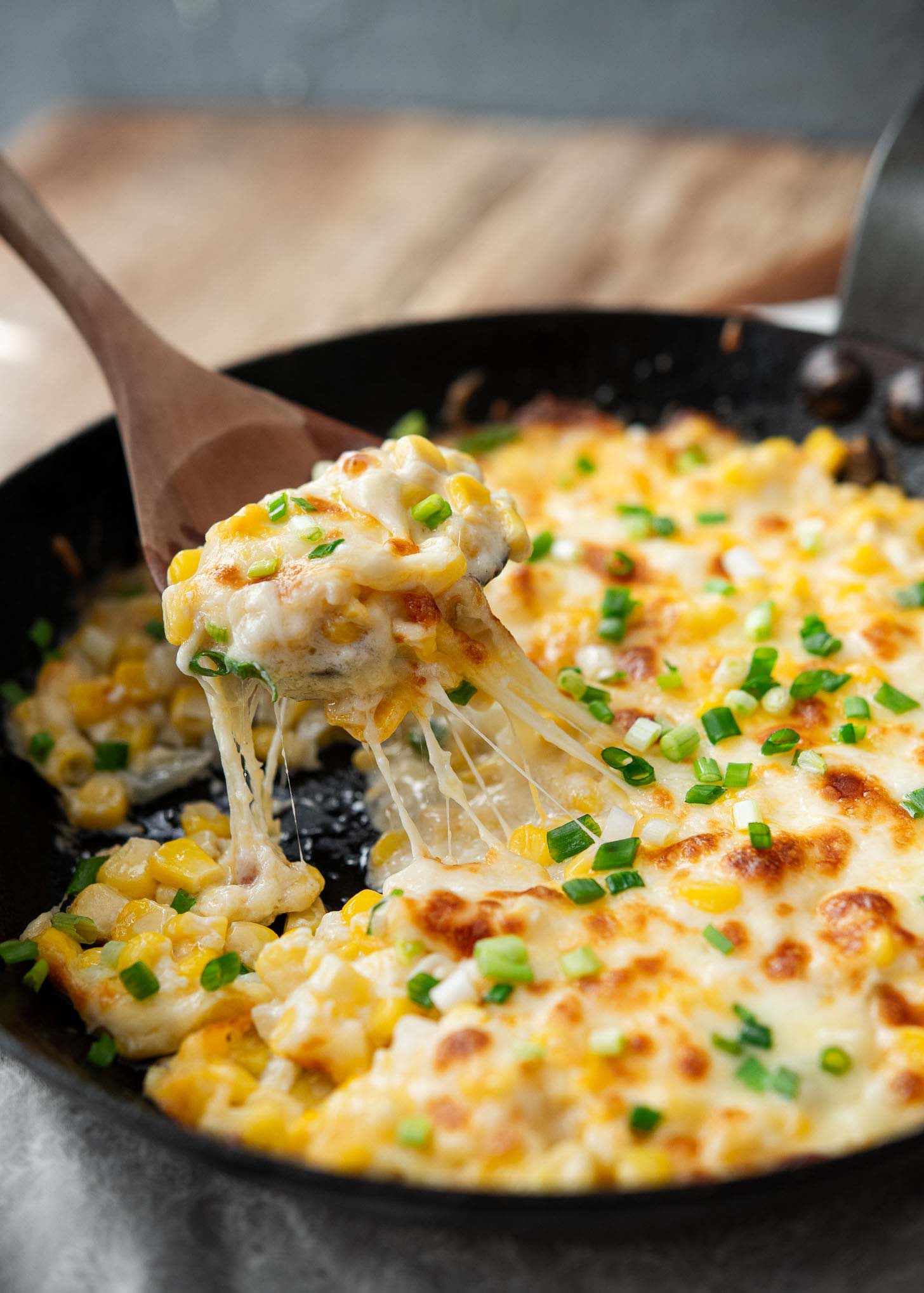 Gooey melted cheese from the baked Korean corn cheese.