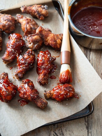 Gochujang sauce glaze brushed on crispy deep-fried wings.